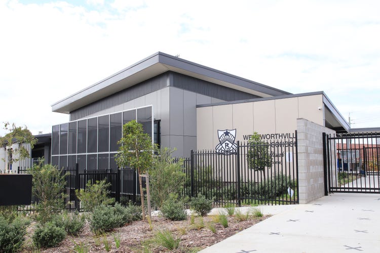 School building with school logo on the wall