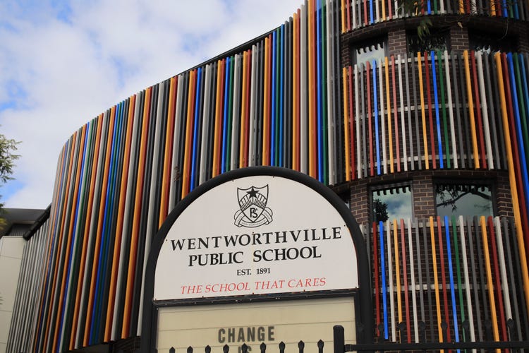 Colourful school building with school sign