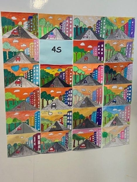 Colour artwork by students displayed on wall